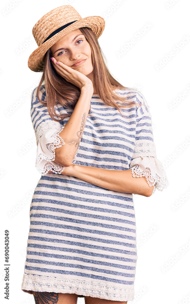 Beautiful caucasian woman wearing summer hat thinking looking tired and bored with depression problems with crossed arms. Beautiful caucasian woman wearing summer hat thinking looking tired and bored with depression problems with crossed arms.