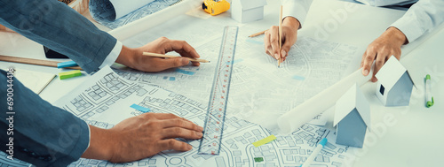 Photos Worker, architect and engineer work on real estate construction project oratory