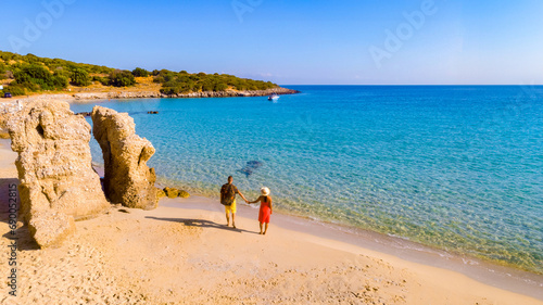 Voulisma Beach Istron Crete Greece, the most beautiful beaches of Crete island Istron Bay near Agios Nikolaos. A young couple on vacation in Greece Crete during summer vacation holidays in Europe photo