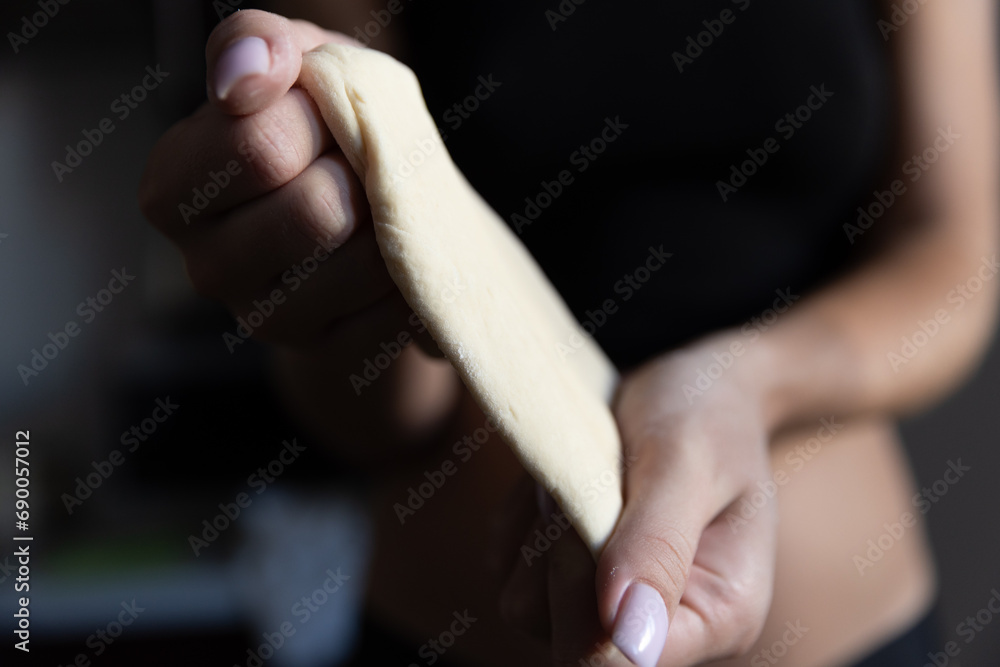  Girl rolling out dough in the kitchen
