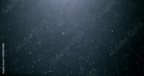 3D rendering generated many small dust randomly floating in the air. Close up and slow-motion movement.