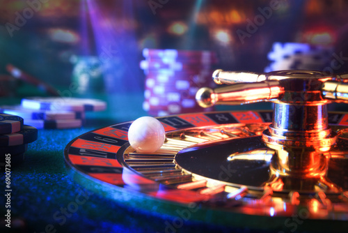 Detail of ball on casino roulette in dark gaming room