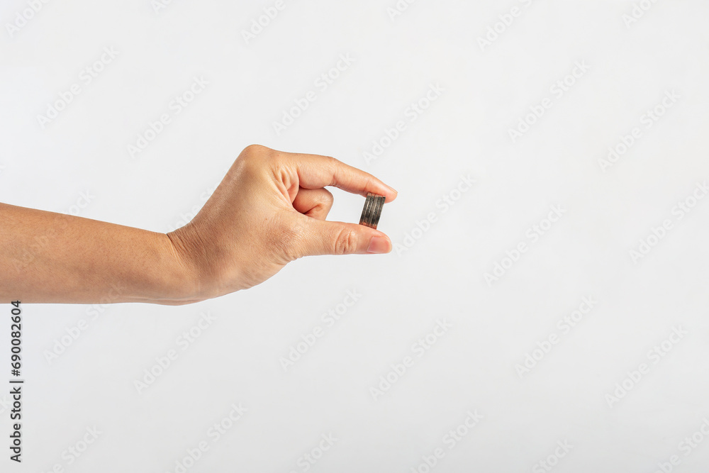 Hand and Coins used for payment in Thailand on white background Hand and Coins used for payment in Thailand on white background