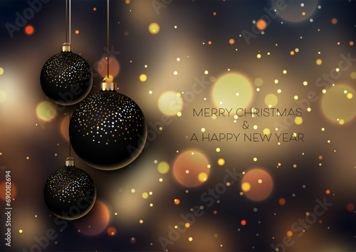 Christmas background with black and gold hanging baubles on a bokeh design