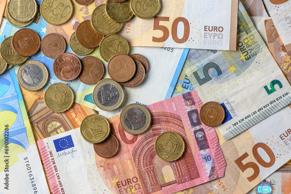 Euro bills and coins scattered on the table as a background 6 Euro bills and coins scattered on the table as a background 6