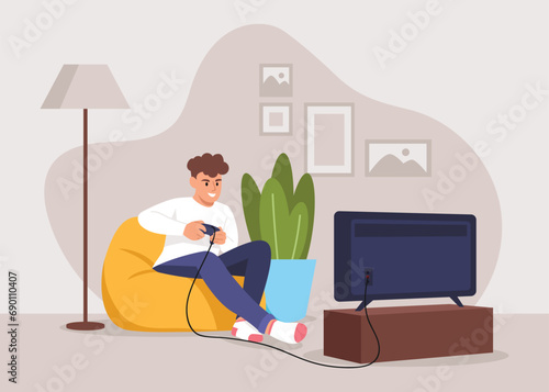 boy playing video games while sitting on an ottoman at home
