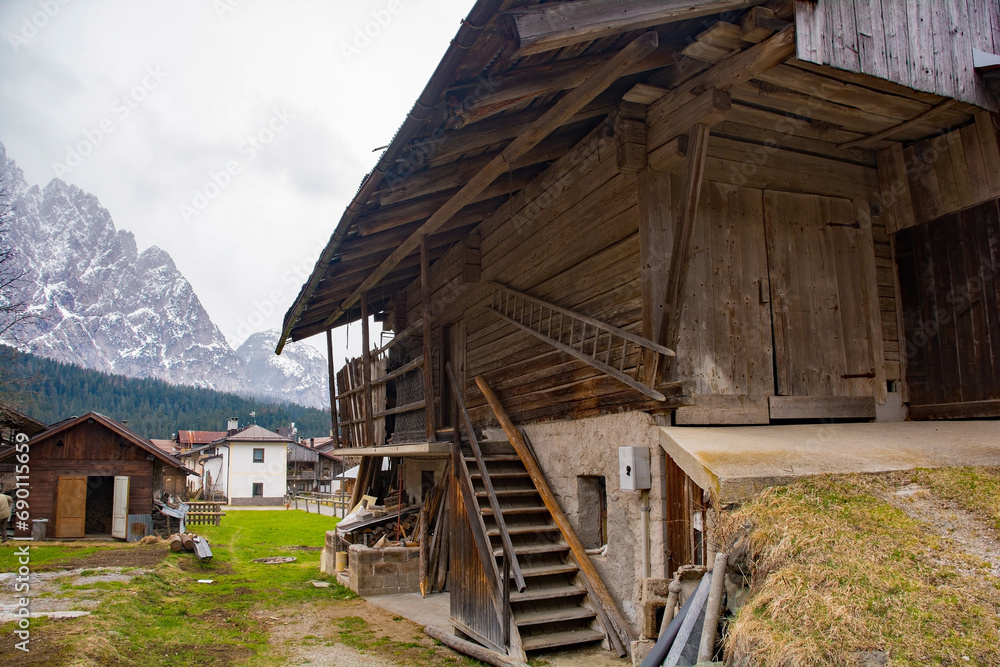 Obraz premium A traditional wooden agricultural building in the historic mountain village of Cima Sappada in Carnia in Udine Province, Friuli-Venezia Giulia, north east Italy
