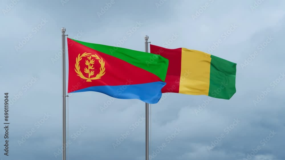Republic of Guinea flag and Eritrea flag waving together on cloudy sky, endless seamless loop, two country relations concept Republic of Guinea flag and Eritrea flag waving together on cloudy sky, endless seamless loop, two country relations concept