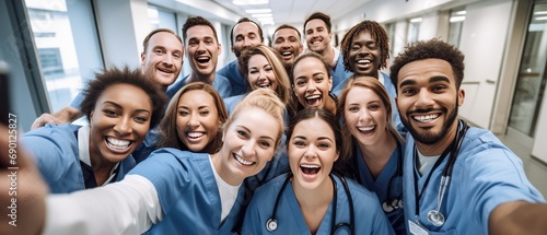 Multicultural medical staff taking selfie together. Teamwork and diversity.