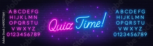 Quiz Time neon lettering on brick wall background