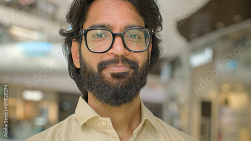 Close up business portrait headshot happy Arabian Hispanic Indian Muslim man agent worker businessman guy in glasses bearded executive entrepreneur employer lawyer male boss manager looking at camera