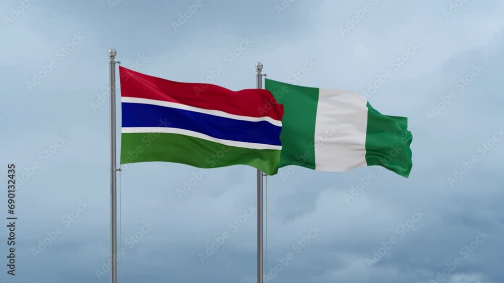 Nigeria flag and Gambia flag waving together on cloudy sky, endless seamless loop, two country relations concept Nigeria flag and Gambia flag waving together on cloudy sky, endless seamless loop, two country relations concept