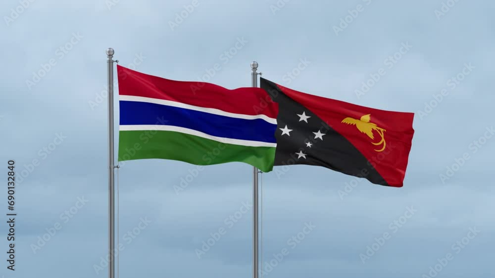 Papua New Guinea flag and Gambia flag waving together on cloudy sky, endless seamless loop, two country relations concept Papua New Guinea flag and Gambia flag waving together on cloudy sky, endless seamless loop, two country relations concept