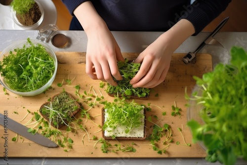 top view of a teenager creating a microgreens sandwich