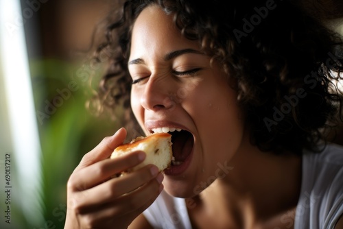 woman biting into a cheese sandwich