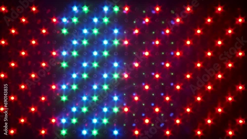 Multi-colored background of glowing RGB LEDs light with different effects. LED Panel with many luminous semiconductor diodes, close-up. LED-dots background of red, green and blue light-emitting diodes photo