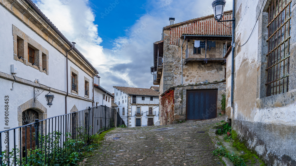 Street and traditional houses of the beautiful town of Candelario, in Salamanca.