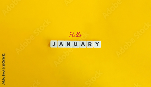 Hello January Banner. Block Letter Tiles and Cursive Text on Yellow Background. Minimalist Aesthetics. photo