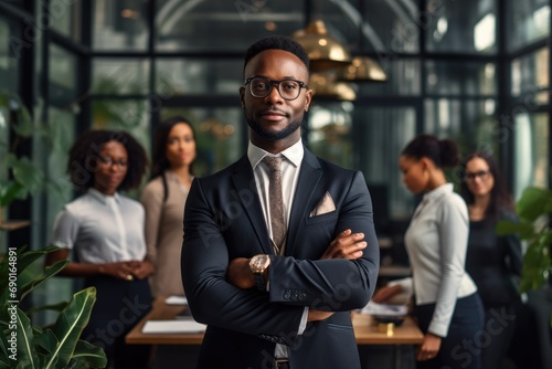 Portrait of confident african american businessman with crossed arms standing in modern office, African American Businessman Boss With Group Of Business People In Creative Office, AI Generated