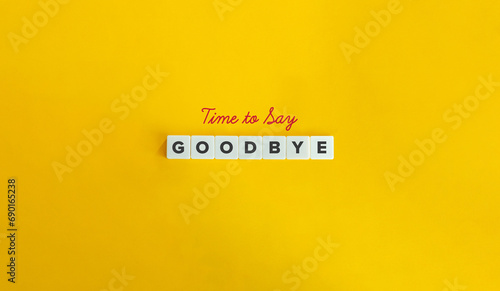 Time to Say Goodbye. Block Letter Tiles  and Cursive Text on Yellow Background. Minimalist Aesthetics.