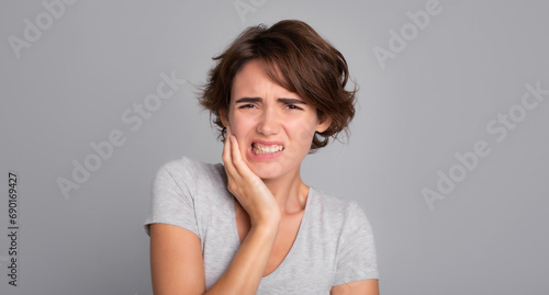 Close up shot of severe toothache in young girl. Dentistry, dental care, tooth pain