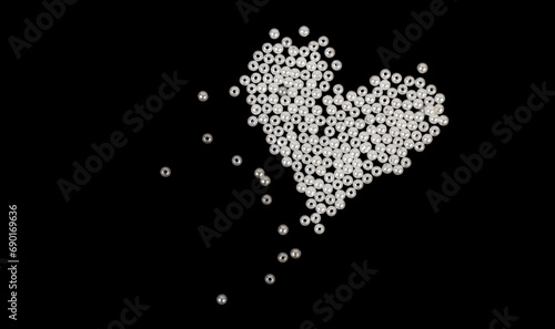Heart made of white beads on a black background