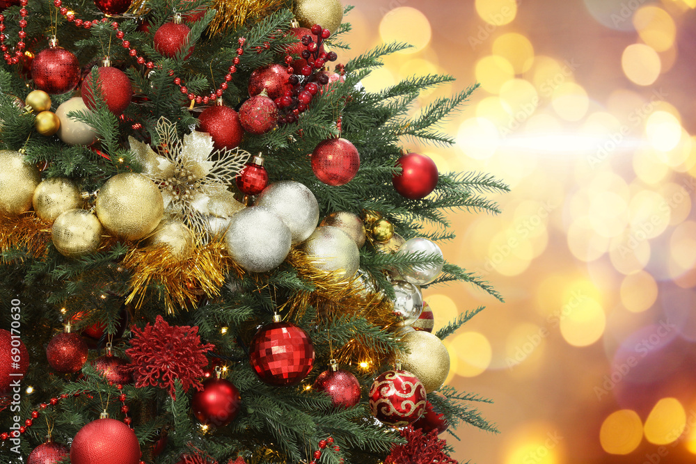 Christmas tree decorated with red and golden festive balls against blurred background, bokeh effect. Space for text Christmas tree decorated with red and golden festive balls against blurred background, bokeh effect. Space for text