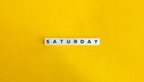 Saturday Word on Block Letter Tiles on Yellow Background. Minimalist Aesthetics.