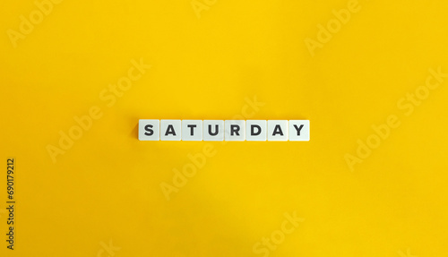 Saturday Word on Block Letter Tiles on Yellow Background. Minimalist Aesthetics. photo