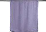 Mockup of violet terry towel PNG, hanging on a hanger, handrail
