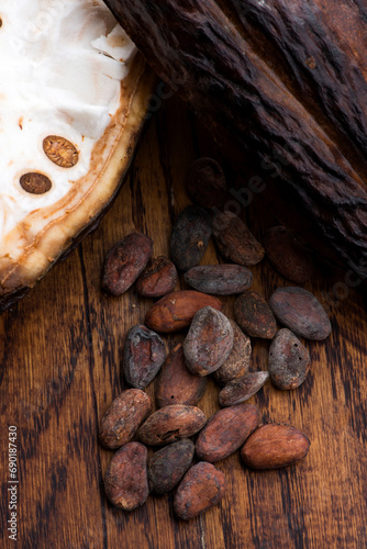 Cocoa (cacao) beans on a beanpod with focus on foreground.