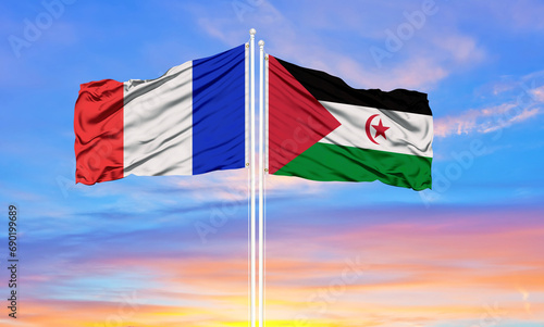 france and Polisario two flags on flagpoles and blue cloudy sky . Diplomacy concept, international relations