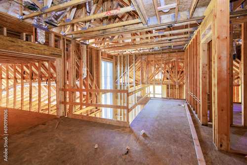 During construction of a new home, unfinished framing beams wooden house area used for construction