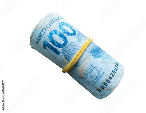 Brazilian money. 100 reais note rolled up with elastic
