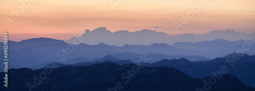The Lights of the Setting Sun over the Mountain Range