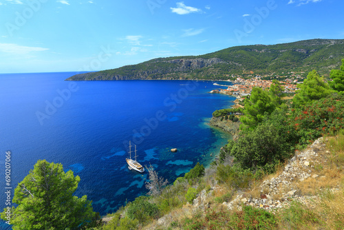 Komiza town, travel destination, sailing ship and clear blue sea, Island Vis, Croatia photo