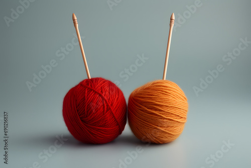 2 Colorful wool balls in plain pastel color background