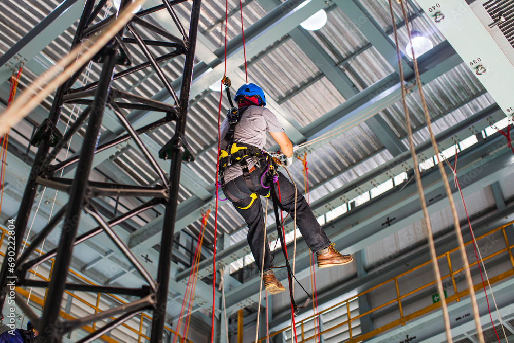 Male worker training rope access