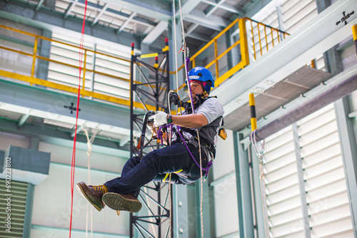 Male worker training rope access photo