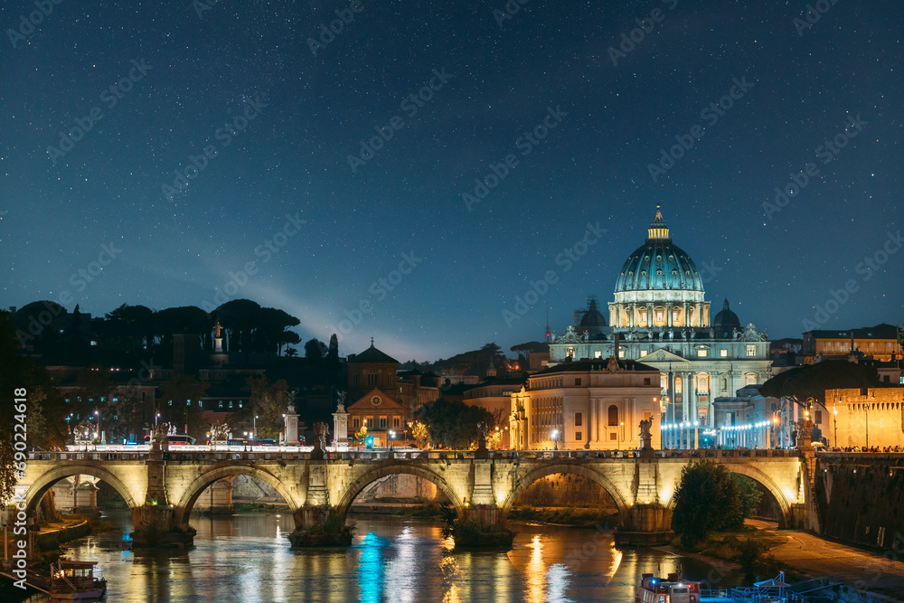 Fototapeta premium Rome, Italy. Papal Basilica Of St. Peter In The Vatican And Aelian Bridge In Evening Night Illuminations night stars sky, cosmos, space,