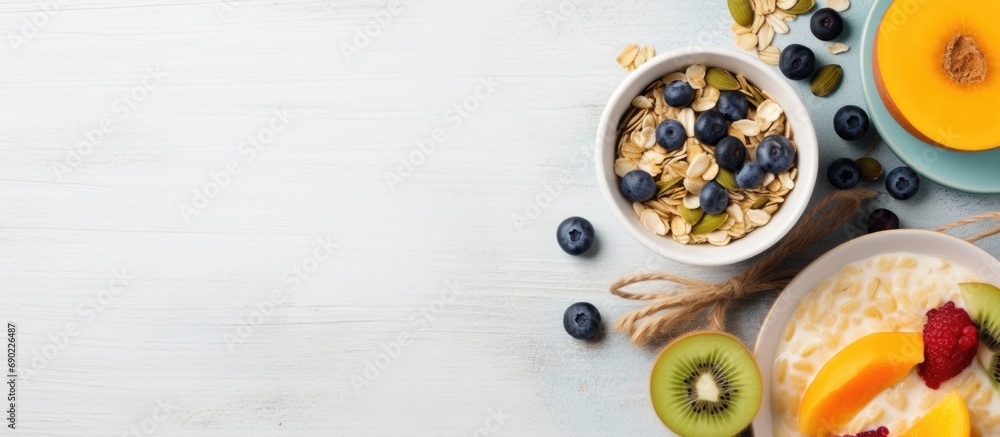 custom made wallpaper toronto digitalHealthy breakfast with oatmeal porridge fruits and nuts Blueberry mango pumpkin seeds nuts coffee cup Top view Female hands. Website header. Creative Banner. Copyspace image