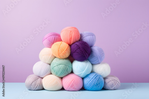 Bunch of wool balls in pastel color background