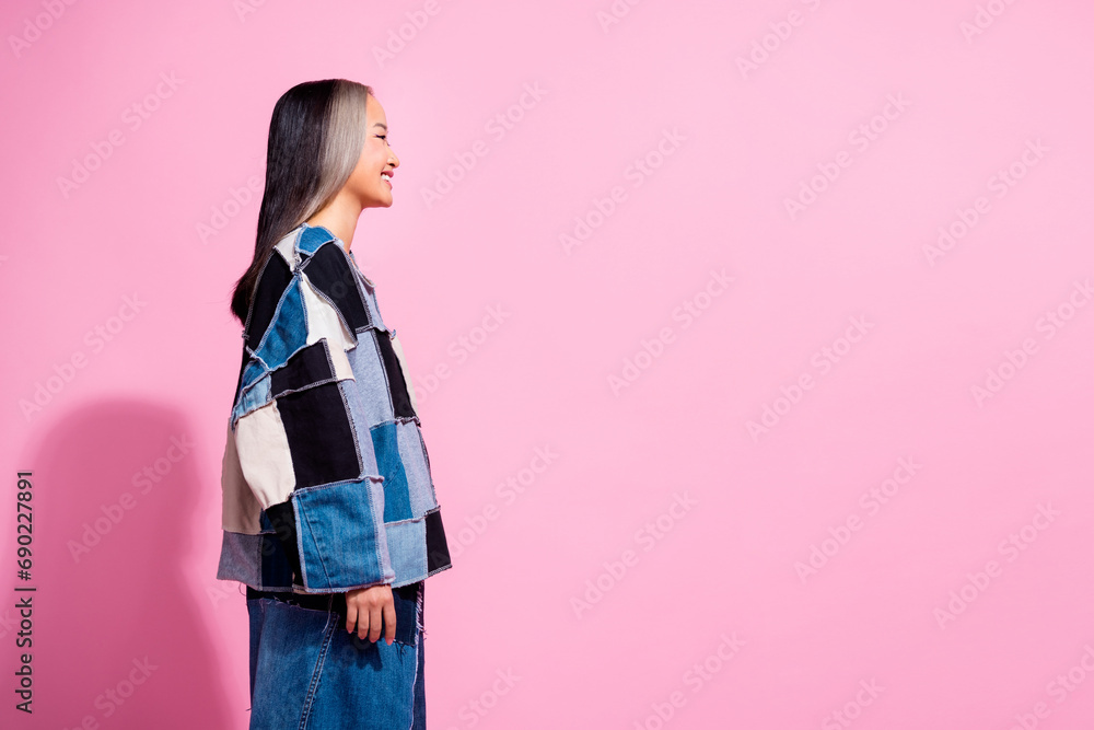 Profile photo of positive nice malaysian girl toothy smile look empty space isolated on pink color background Profile photo of positive nice malaysian girl toothy smile look empty space isolated on pink color background