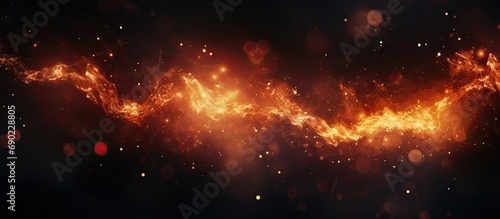 Fire embers border over black background Fire sparks background Abstract dark glitter fire particles lights bonfire in motion blur Flame Border. Website header. Creative Banner. Copyspace image photo