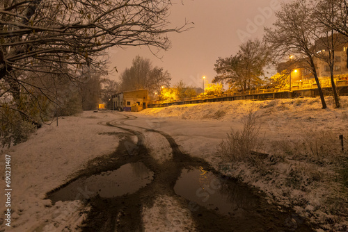 Night snowy Nature with Trees around River Vltava, Holesovice, the most cool Prague District, Czech Republic photo