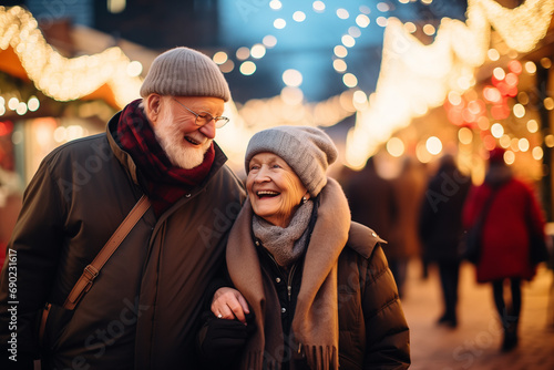 Elderly couple walks Christmas market