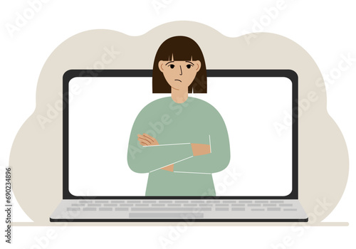 Woman communicates via videoconference through laptop screen. The concept of online meetings, webinars, remote work or work from home.