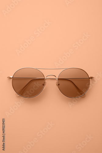 Sunglasses in peach fuzz color, ai generated