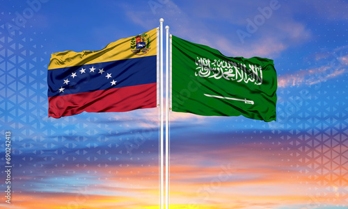 Venezuela and Saudi Arabia two flags on flagpoles and blue cloudy sky . Diplomacy concept, international relations