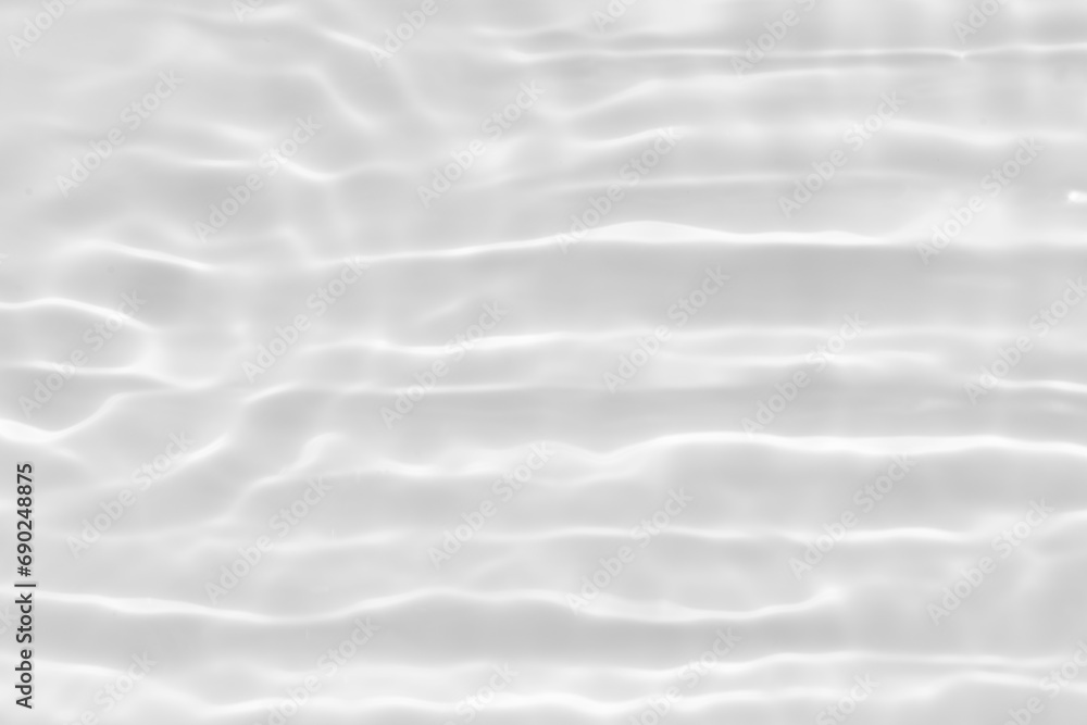White water with ripples on the surface. Defocus blurred transparent white colored clear calm water surface texture with splashes and bubbles. Water waves with shining pattern texture background. White water with ripples on the surface. Defocus blurred transparent white colored clear calm water surface texture with splashes and bubbles. Water waves with shining pattern texture background.